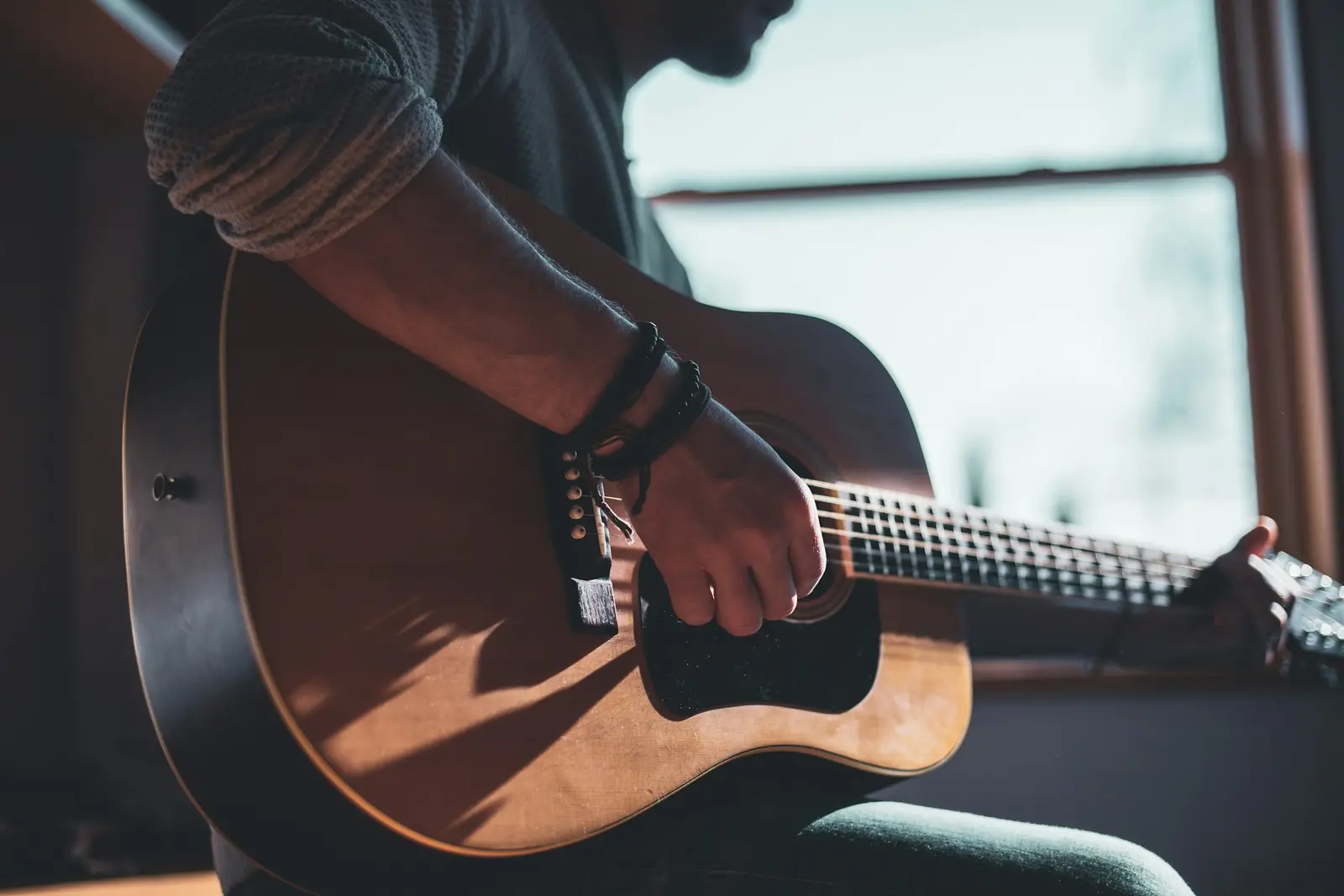 An acoustic guitar being played